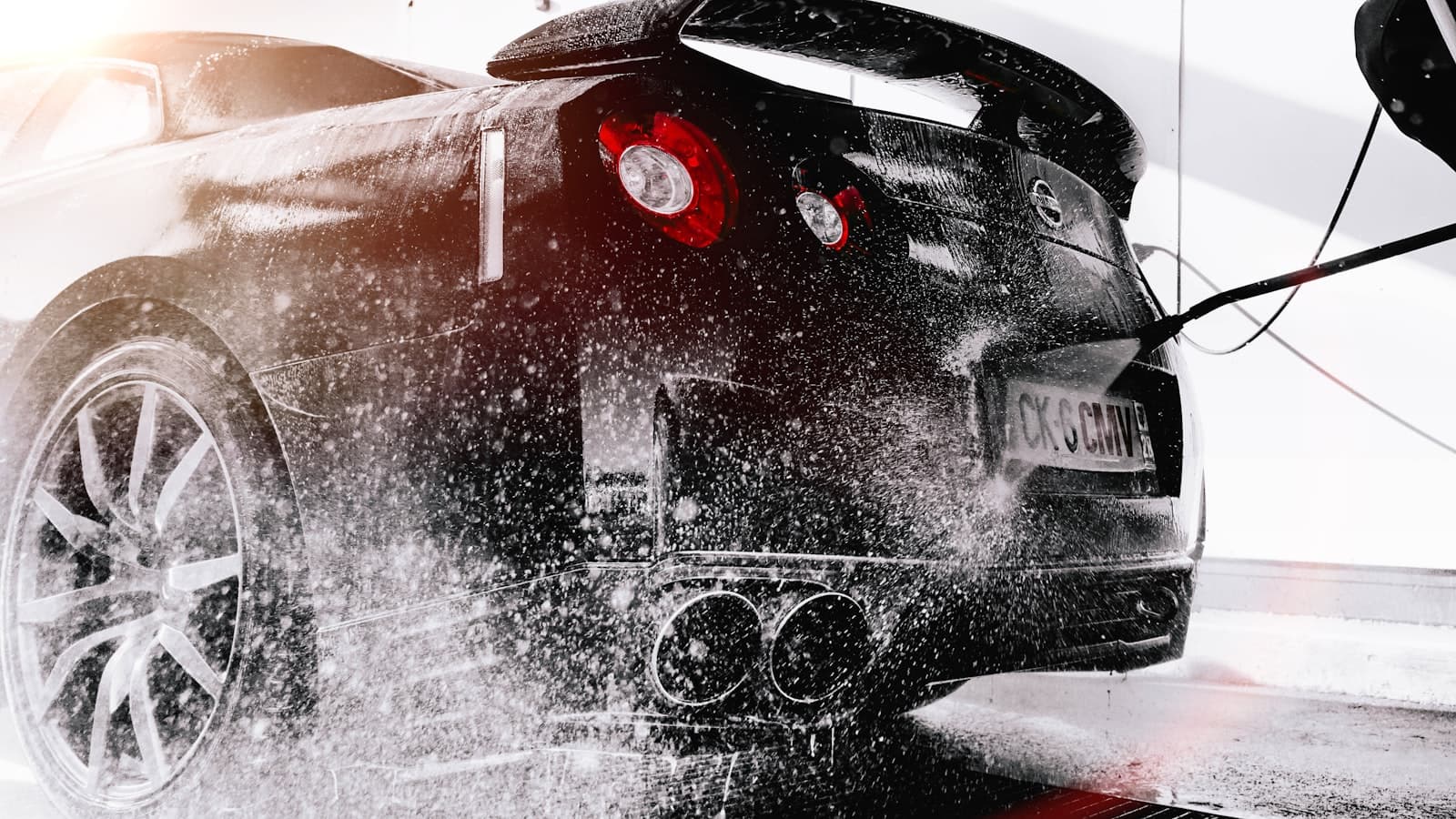 Professional foam wash covering a vehicle exterior